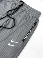 Nke Printed Logo Trouser In Light Grey