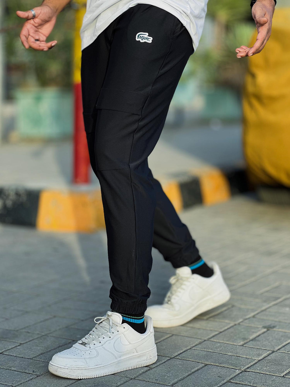 Lacste Embossed Logo Men Trouser In Black