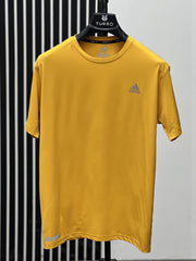 Imported Dry Fit Tee With Reflector Logo In Mustard
