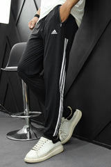 Adds Signature Side Stripes Sportswear Trouser in Black