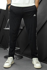 Adds Signature Side Stripes Sportswear Trouser in Black