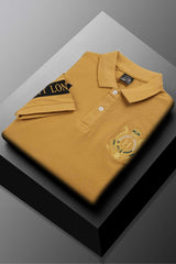 Hackt Lndn Heritage Crown Graphic Men's Polo Shirt In Mustard