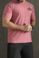 Alo Yoga Distinctive Front Logo Arrival Dry-Fit Tee In Pastel Pink