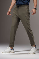 Nke's Self Textured Elastic Dry-Fit Trouser In Sand Brown