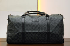 Coah Imported Signature Print Travel Bag in Dark Grey